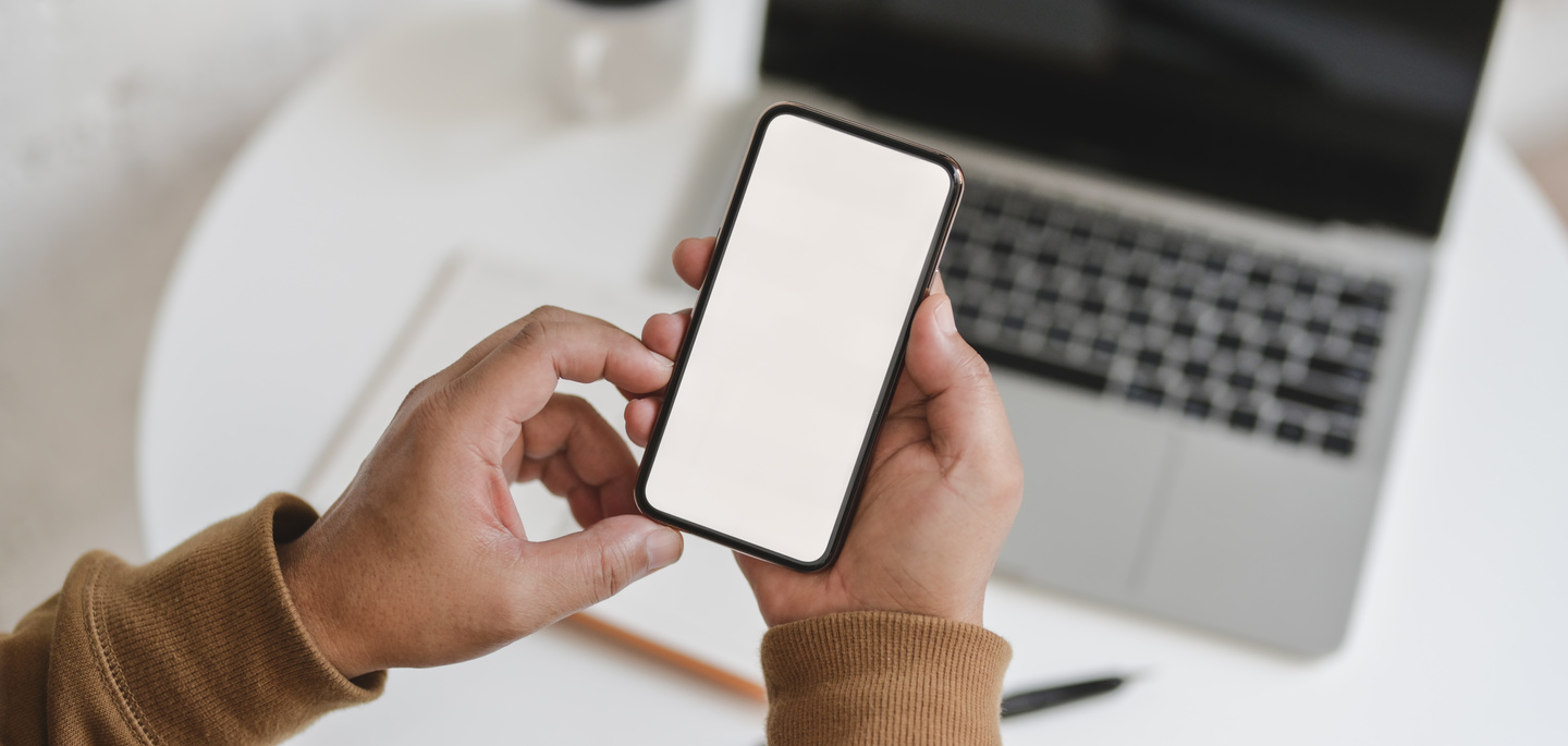 Person Holding White Iphone 5 C